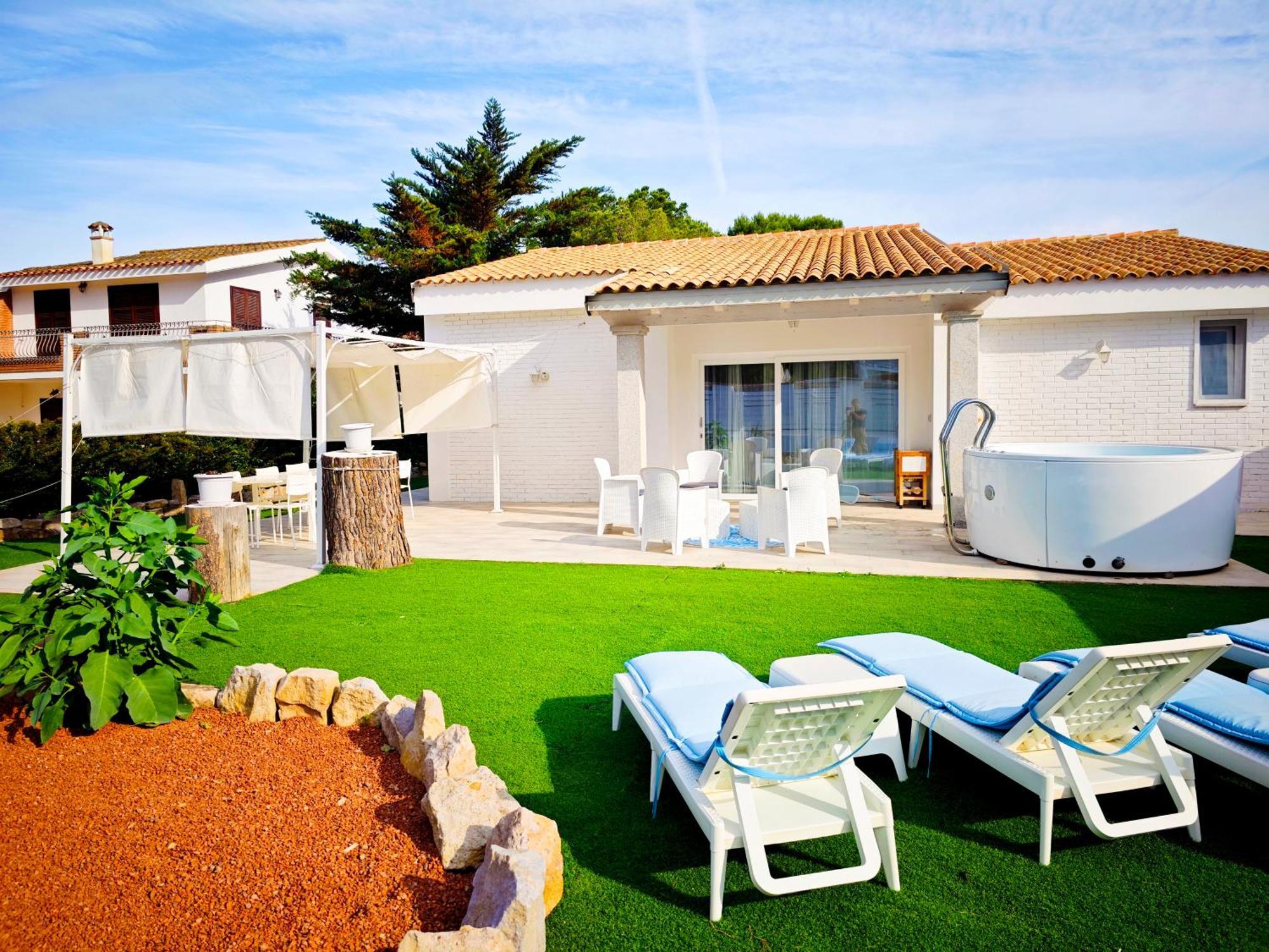 Ikebana Villas Porto Pino Beach Exterior foto
